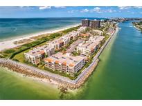 Expansive aerial view of beachfront condos, showcasing their proximity to the beautiful Gulf of Mexico at 7564 Bayshore Dr # 207, Treasure Island, FL 33706