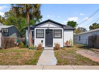 Shot of the bungalow exterior showcases neat landscaping and an inviting walkway at 3765 21St S Ave, St Petersburg, FL 33711