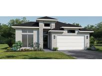 Modern home with a two-car garage, stone accents, and a well-manicured lawn at 425 Sun Chaser Dr, Nokomis, FL 34275