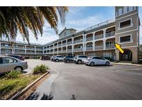 Condo complex featuring ample parking and nicely manicured landscaping at 2321 Ecuadorian Way # 41, Clearwater, FL 33763