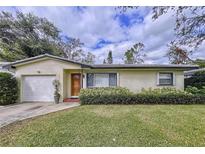 Charming single-story home with a well-maintained lawn and a cozy, inviting entrance at 1216 Lotus Path, Clearwater, FL 33756