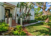 Stunning Mediterranean-style home entrance with lush landscaping and a beautifully designed walkway at 2633 N Dundee St, Tampa, FL 33629