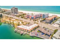 Gorgeous aerial view of beach condo overlooking white sand beach and blue ocean at 4103 Gulf Blvd # 205, St Pete Beach, FL 33706