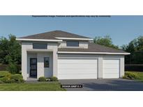 Modern home with a two-car garage, gray roof, and beautiful landscaping at 426 Sun Chaser Dr, Nokomis, FL 34275