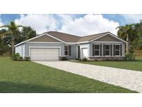 Charming single-story home with a two-car garage and a well-manicured front yard at 11953 Vista Park Ter, Venice, FL 34293