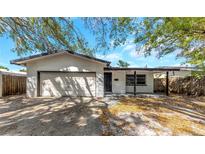 Charming single-story home with a brick facade, front porch, and an attached garage at 3553 34Th N Ave, St Petersburg, FL 33713