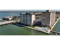 Stunning aerial view of waterfront condo community with pool and cityscape backdrop at 5220 Brittany S Dr # 1108, St Petersburg, FL 33715