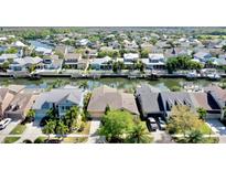 Beautiful aerial view of waterfront homes in a canal community, showcasing stunning architecture and waterfront living at 5709 Sea Turtle Pl, Apollo Beach, FL 33572