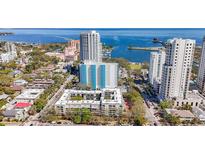 Aerial view of a high-rise apartment complex and surrounding buildings with beautiful water views at 105 4Th Ne Ave # 501, St Petersburg, FL 33701