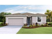 Charming single-story home featuring a neutral color palette, well-manicured lawn, and a convenient two-car garage at 10523 Farm Hill Ave, Land O Lakes, FL 34638
