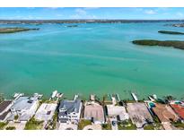 Breathtaking aerial view of waterfront homes with docks on a picturesque coastline at 535 Johns Pass Ave, Madeira Beach, FL 33708