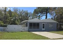 Charming single story home with a manicured lawn and white picket fence at 6194 59Th N Pl, St Petersburg, FL 33709