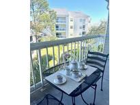 Inviting balcony with outdoor seating and lovely view of building and surroundings at 6826 Stones Throw N Cir # 11305, St Petersburg, FL 33710