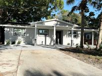 Charming single-story home with a well-maintained front yard and covered porch at 1039 N Missouri Ave, Clearwater, FL 33755