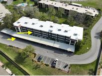 Community featuring assigned covered parking, community pool, and multiple units in a beautiful location at 1375 Doolittle Ln # 103, Dunedin, FL 34698