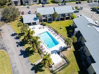 Inviting community pool surrounded by lush landscaping and well-maintained buildings, perfect for relaxation at 4215 E Bay Dr # 1701C, Clearwater, FL 33764