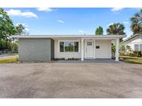 Charming single-story home featuring a brick accent wall, front door, and well-maintained landscaping at 4500 22Nd S Ave, St Petersburg, FL 33711