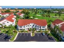 Beautiful two-story condo with a red tile roof, well maintained landscaping, and ample parking at 6059 Bahia Del Mar Blvd # 134, St Petersburg, FL 33715