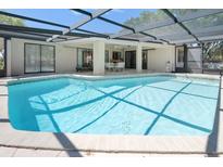 Inviting screened-in pool area with ample seating, perfect for relaxing or entertaining guests at 2025 E View Dr, Sun City Center, FL 33573