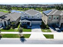 Charming two-story home with landscaped front yard and inviting entrance, showcasing curb appeal at 17802 Everlong Dr, Land O Lakes, FL 34638