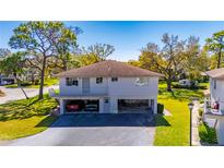 Charming two-story home with covered parking, beautiful landscaping, and a welcoming front porch at 1828 Bough Ave # 3, Clearwater, FL 33760