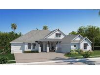 Stunning single-Gathering home boasts a symmetrical facade, two-car garage, and manicured landscaping at 19469 Autumn Oak Ln, Brooksville, FL 34601