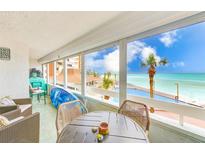 Enclosed balcony features a sitting area with beautiful Gulf views at 17940 Gulf Blvd # 2B, Redington Shores, FL 33708