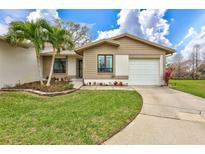Charming single-story home with a well-manicured lawn and inviting curb appeal in a sunny setting at 11430 94Th St, Largo, FL 33773
