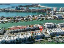 An aerial view shows the condo's ideal location near beaches, with a red pin marking the unit at 140 Brightwater Dr # 1, Clearwater Beach, FL 33767