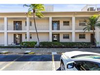 The condo complex features an attractive façade and easy access to parking at 19029 Us Highway 19 N # 2-17, Clearwater, FL 33764