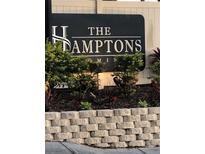The Hamptons community sign with manicured landscaping adds curb appeal at 224 Red Maple Pl # 224, Brandon, FL 33510