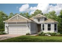 Charming single story home with a two car garage and well manicured landscaping at 29863 Imperati Blvd, Wesley Chapel, FL 33543