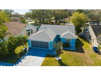 Charming single-Gathering home with manicured lawn and a two-car garage at 4331 Foxboro Dr, New Port Richey, FL 34653