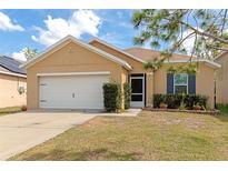 Charming single-Gathering home featuring a well-maintained lawn, neutral exterior, and a two-car garage at 5162 11Th E St, Bradenton, FL 34203