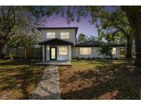 Charming two-story home featuring a well-maintained front yard and modern architectural details at 708 15Th W Ave, Palmetto, FL 34221