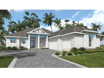 Charming single-story home boasts lush landscaping, a paved driveway, and a welcoming covered porch at 5050 Elm Leaf Dr, Brooksville, FL 34601