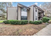 Attractive exterior of a two-story home with a landscaped yard and unique architectural details at 12025 Environmental Dr # 5, New Port Richey, FL 34654