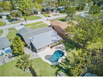 Stunning aerial view of a home with a backyard pool and well-maintained landscaping at 1842 Oklahoma Ne Ave, St Petersburg, FL 33703