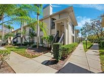 Charming townhouse with tropical landscaping, sunny skies and well manicured walkway and private front entrance at 3350 Mermoor Dr # 1201, Palm Harbor, FL 34685