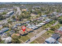 An aerial view of a residential neighborhood with mature landscaping and a home pinpointed at 6618 3Rd N Ave, St Petersburg, FL 33710
