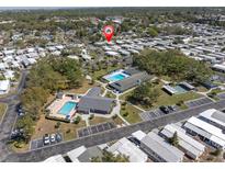 Beautiful aerial view of the community featuring pools, common areas, and neatly arranged homes at 9790 66Th N St # 469, Pinellas Park, FL 33782