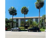 Inviting condo building featuring lush palm trees and well-maintained landscaping on a sunny day at 125 5Th Ne Ave # 240, St Petersburg, FL 33701