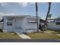 Charming single-story home with a well-maintained lawn and carport; perfect for easy living at 4851 W Gandy Blvd # B5L19, Tampa, FL 33611