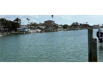 Scenic waterfront view of boats docked along the canal, ideal for boating enthusiasts and waterfront living at 525 Crystal Dr, Madeira Beach, FL 33708
