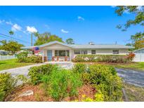 Charming single-story home with a well-maintained front yard and inviting curb appeal on a sunny day at 11601 86Th Ave, Seminole, FL 33772