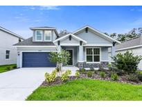 Charming single-Gathering home with a well-manicured lawn and a two-car garage, offering curb appeal at 2497 Orange Harvest Pl, Seffner, FL 33584