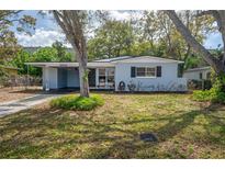 Charming one-story home with a well-maintained front yard and covered parking at 2918 W Ellis Dr, Tampa, FL 33611