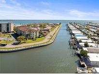 Beautiful aerial view of waterfront community with boat docks and a bridge spanning the bay at 19029 Us Highway 19 N # 7-9, Clearwater, FL 33764