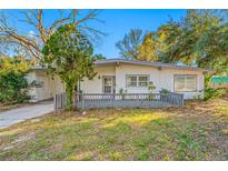 Charming single-story home featuring a quaint front porch and well-maintained landscaping at 3104 Bay St, Sarasota, FL 34237