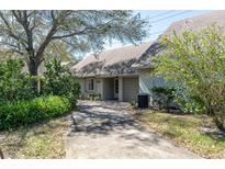 Charming single-story home with attached garage, well-maintained landscaping, and private drive at 3416 Annette Ct # 71, Clearwater, FL 33761